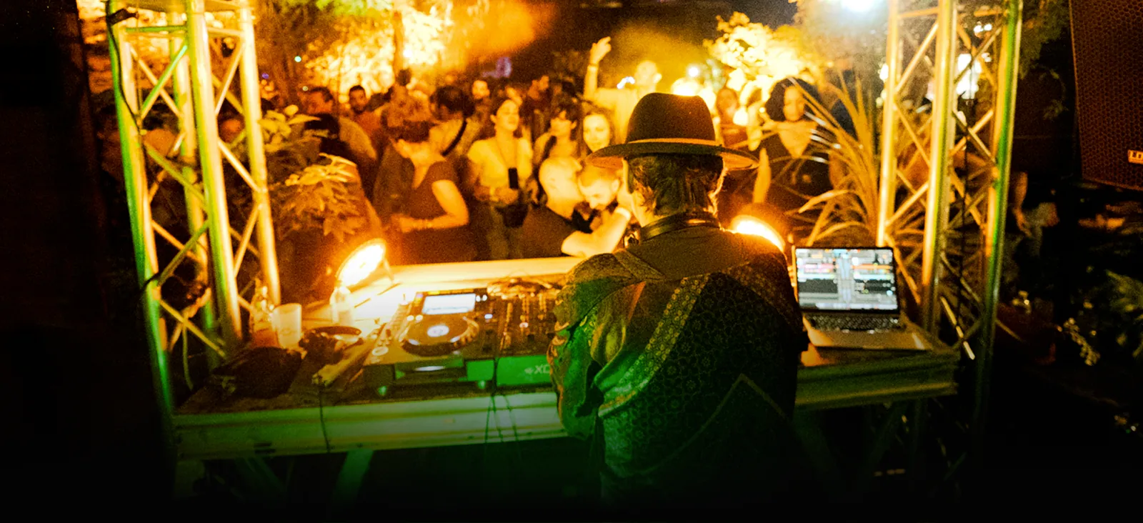Piccaya performing a live DJ set for an outdoor crowd